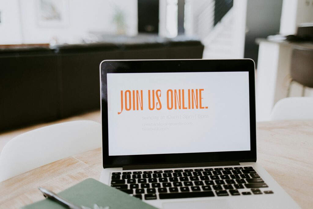 Laptop Screen with the words "Join Us Online"